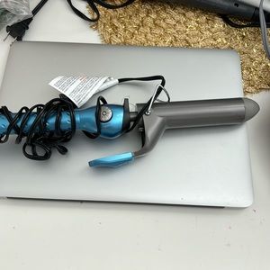 blue curling iron with clip